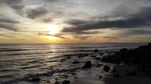 Beach with rocks at sunset Stock Footage 297228803
