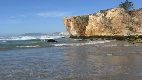 Beach with Rocky Cliff Video stock 78079658