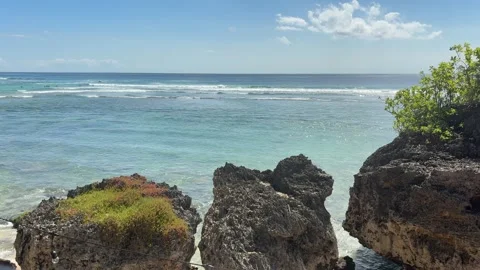 Beach with Rocky Cliffs in the Foreground. Stock Footage 320176147