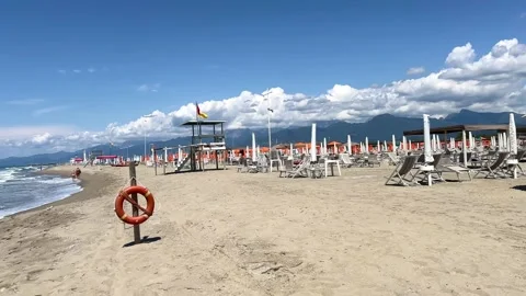 Beach with rows of umbrellas and chairs on beach in Viareggio Tuscany Italy. Stock Footage 340335930