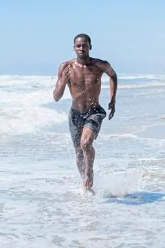 Beach run workout Stock Photos