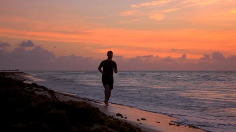Beach Runner at sunrise Stock Footage 88635607