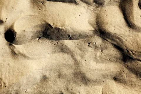 Beach sand close-up Stock Photos