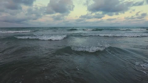 Beach sand close-up, white foamy nature, dramatic sky, exotic shore. Beach text Stock Footage 262561295