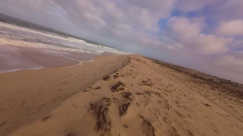 Beach sand drifts toward ocean water. After the storm Stock Footage 345149116