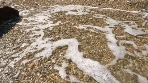 Beach sand hit by foaming waves 1 Video stock 319807175