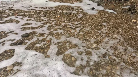 Beach sand hit by foaming waves Stock-Footage 319807195