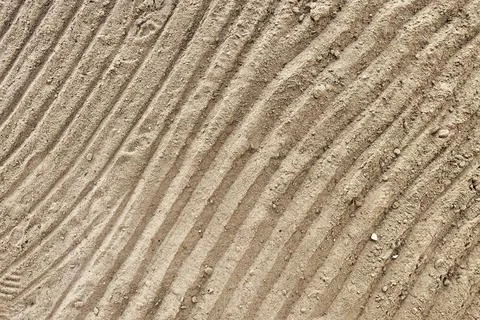 Beach sand pattern as background with natural wave. Natural sand beach sand t Stock Photos