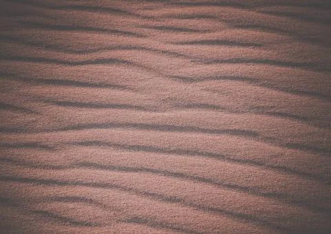 Beach sand pattern Beach sand pattern on the sand dunes in the desert Copy... Stock Photos