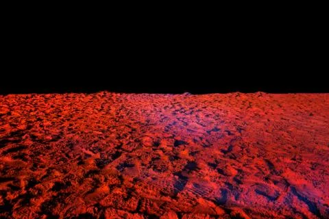 Beach sand in red light looks like a surface of Mars Stock Photos