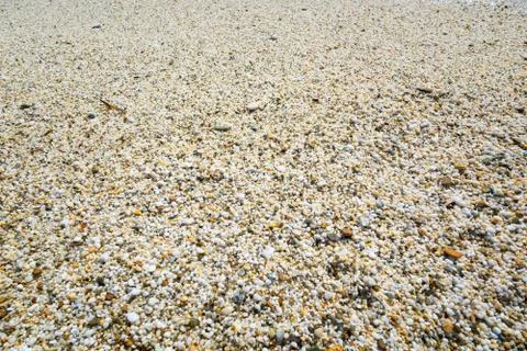 Beach sand texture composed of tiny polished stones 写真素材