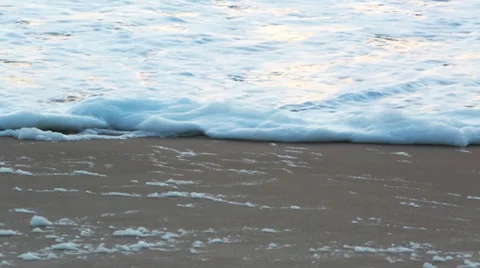 Beach sand textured background with waves coming an going back to the ocean Stock Footage 35253042