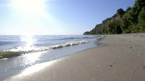Beach sand textured background with waves coming an going back to the ocean Stock Footage 80551330