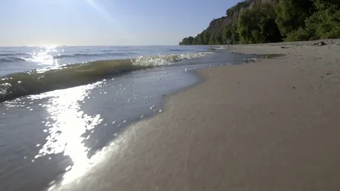 Beach sand textured background with waves coming an going back to the ocean Video stock 80551349