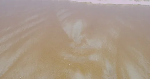 Beach sands at the coast with ocean waves rolling over Stock Footage 150640875