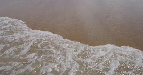 Beach sands at the coast with ocean waves rolling over Stock Footage 150642712
