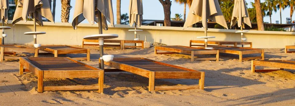 Beach scene in Side Turkey with empty umbrellas and sun loungers. Vacation at Stock-Fotos