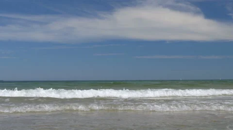 Beach scene with small waves. Peaceful and relaxing. Video stock 65879804
