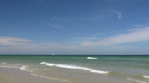 Beach scene with small waves. Peaceful and relaxing. 스톡 동영상 65880076