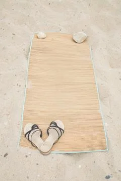 Beach scene in the Summer with Flip-Flops, Beach Mat Stock Photos