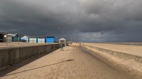 Beach scene on a summers day. Boy riding his hover-board.on the seafront be.. Видео 240285826