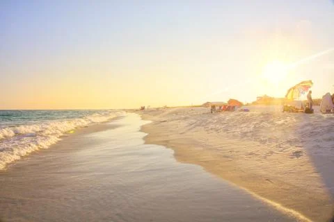 Beach scene at sunset Stock Photos