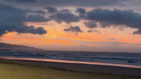Beach scene at sunset, where powerful waves. Stock Footage 330981847
