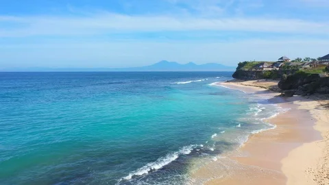 Beach scene - turquoise transparent ocean and white sand beach. Stock Footage 129502528