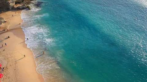 Beach scene - turquoise transparent ocean and white sand beach. Stock Footage 129502943