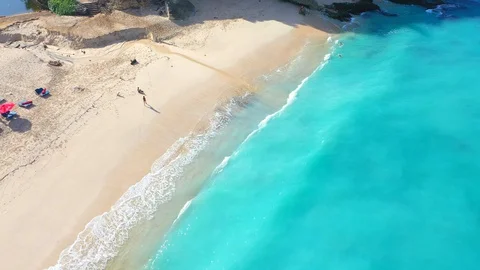 Beach scene - turquoise transparent ocean and white sand beach. Stock Footage 129503830