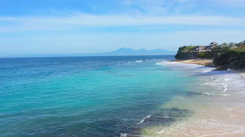 Beach scene - turquoise transparent ocean and white sand beach. Video stock 129503856