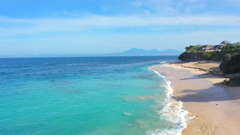 Beach scene - turquoise transparent ocean and white sand beach. Stock Footage 129503913