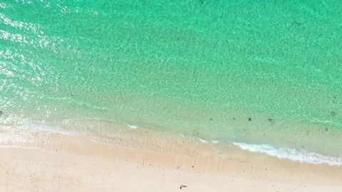 Beach scene - turquoise transparent ocean and white sand beach. Stock Footage 133820523