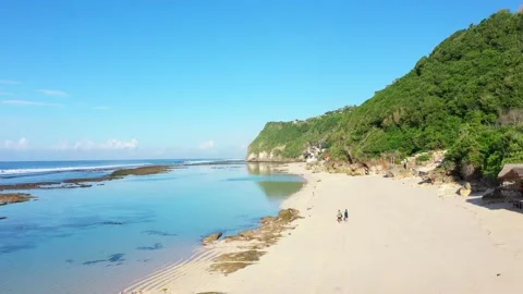 Beach scene - turquoise transparent ocean and white sand beach. Stock Footage 133820787