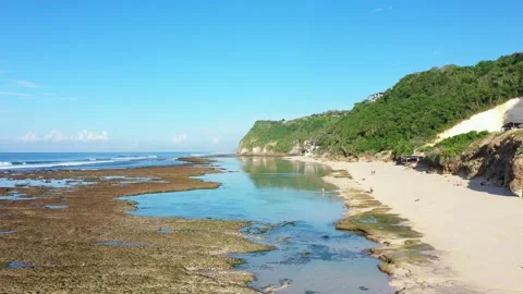 Beach scene - turquoise transparent ocean and white sand beach. Stock Footage 133820963