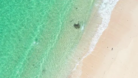 Beach scene - turquoise transparent ocean and white sand beach. Stock Footage 133821075