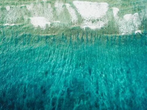 Beach scene with turquoise water from above Stock Photos