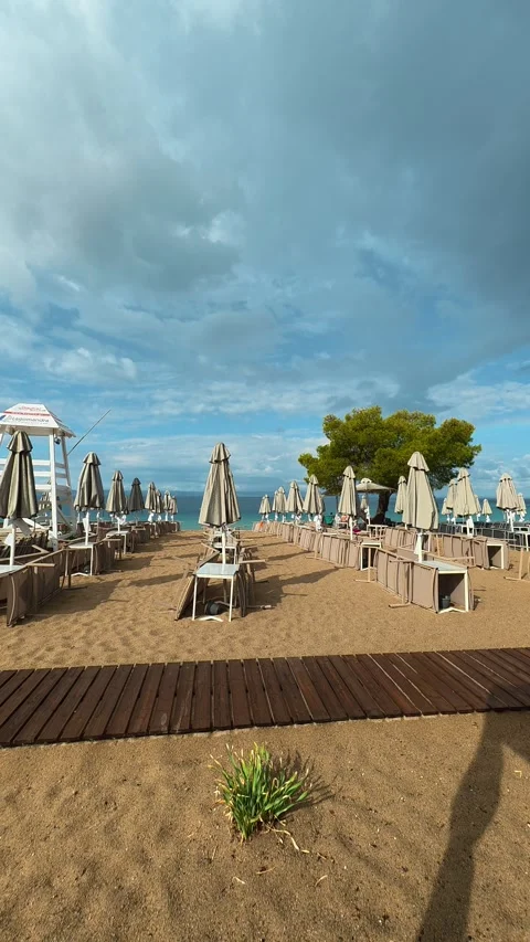 Beach scene under cloudy sky. Lagomandra, Vertical Stock Footage 340651394