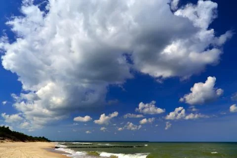 Beach, sea and clouds Stock Photos