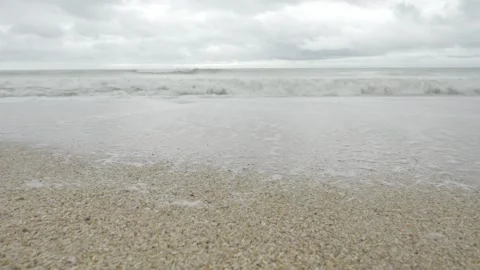 Beach sea in cloudy day whilte rain and storm is coming, scary seashore sce.. Видео 339571277
