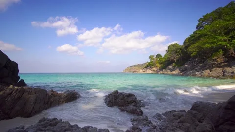 Beach sea sand sun cloud water wave blue sky background Freedom Phuket Thailand Stock Footage 153376207