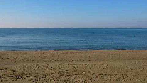 Beach with sea waves with calm sky Stock Footage 124533258