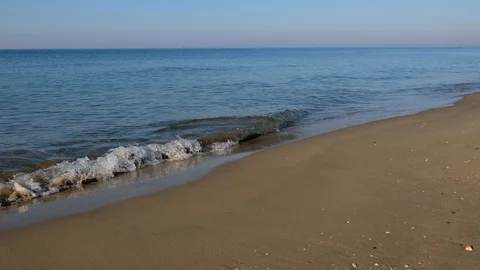 Beach with sea waves with calm sky Stock Footage 124533947