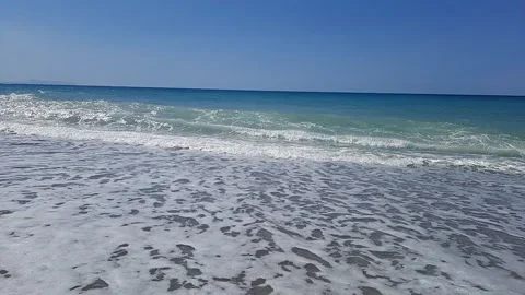 Beach with sea waves with calm sky Stock Footage 308412564