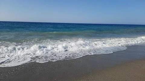 Beach with sea waves with calm sky Stock Footage 308412747