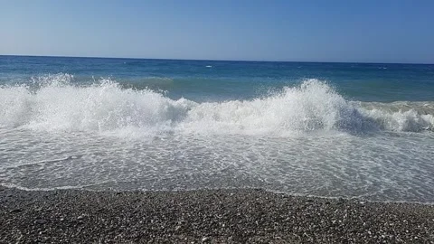 Beach with sea waves with calm sky Stock Footage 308412772