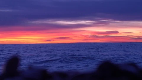 On the beach sea waves at sunset. Stockbeeldmateriaal 122410915