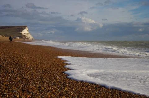 Beach at Seaford - white cliffs in the background. Stock Photos