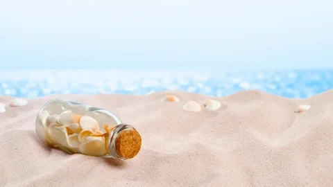 On the Beach - Shells in a bottle placed in front of azure sea - loop - ProRes 스톡 동영상 77609887