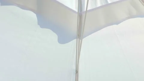 Beach shore, blue sky. Protective beach umbrella from sun. Strong wind Video stock 159795066